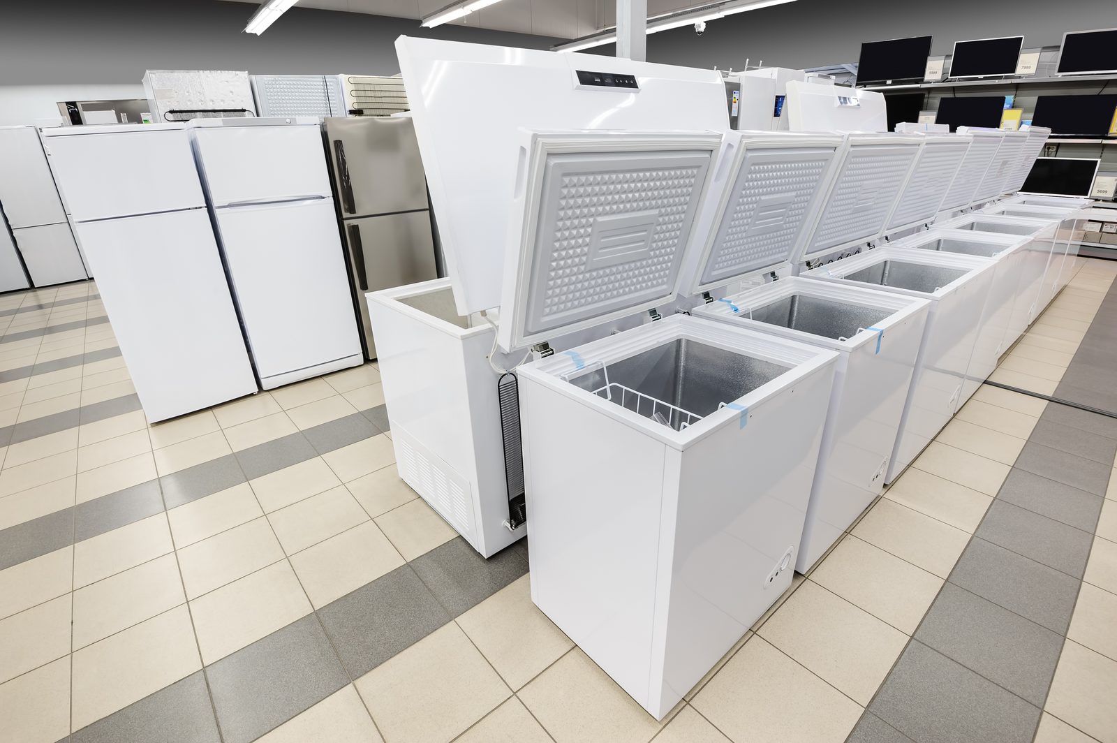 Row of upright glass-door coolers and refrigerators